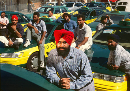 Aman Singh, owner of Green Cab, with employees suffering the economic consequences of 911, for Businessweek